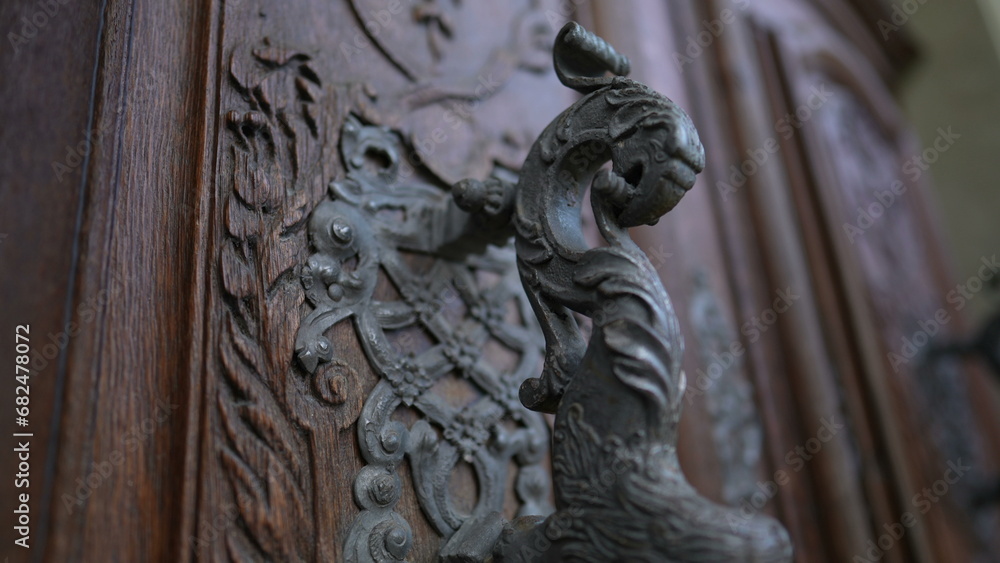 Beautiful ancient door filled with adornment, doorknob and ornamentation. Aesthetic antique traditional craftsmanship Beautiful ancient door filled with adornment, doorknob and ornamentation. Aesthetic antique traditional craftsmanship