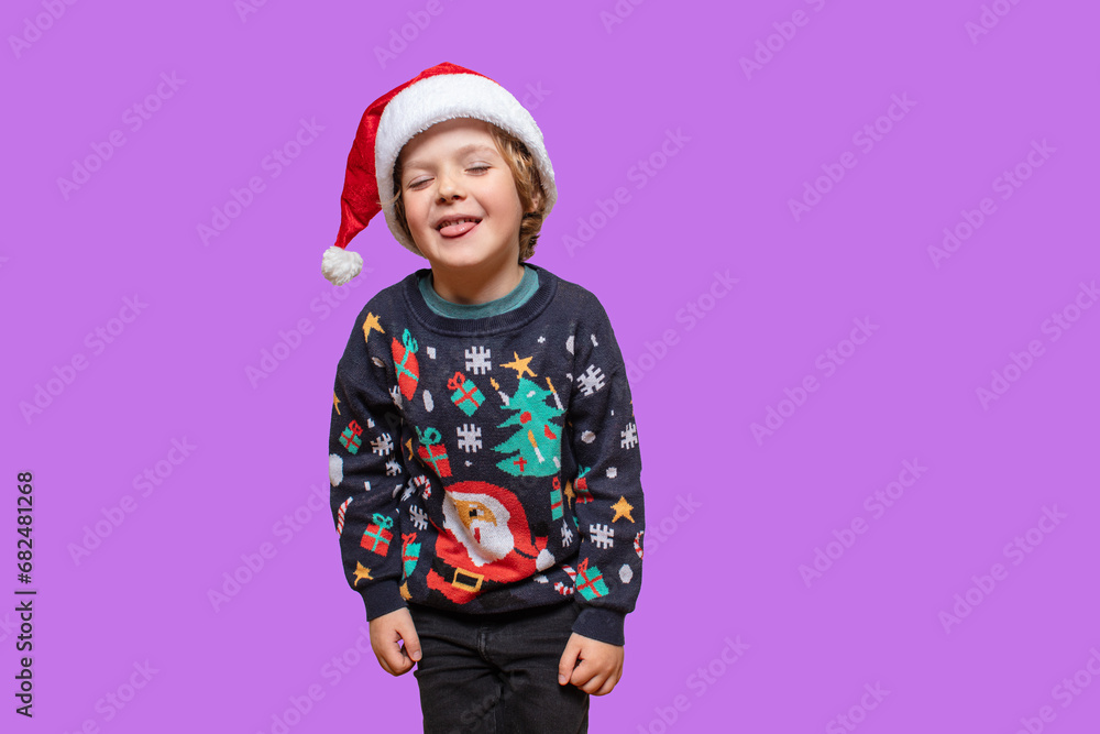 Emotional Christmas boy in a holiday clothes . Happy child on a color back . Happy New Year. Merry Christmas! The child is waiting for the winter holidays. Boy shocked that winter holidays is coming. Emotional Christmas boy in a holiday clothes . Happy child on a color back . Happy New Year. Merry Christmas! The child is waiting for the winter holidays. Boy shocked that winter holidays is coming.