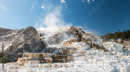 Steaming Palette Hot Spring terraces and Devil's Thumb, Yellowstone National Park, Wyoming, USA photo