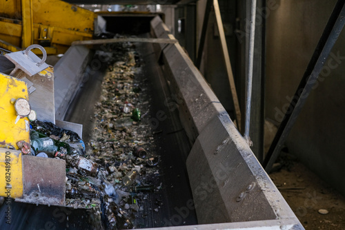 Bottles and glass materials go to a conveyor belt to be recycled
