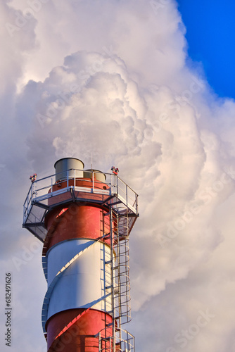 Heavy white smoke from chimney of a powerplant