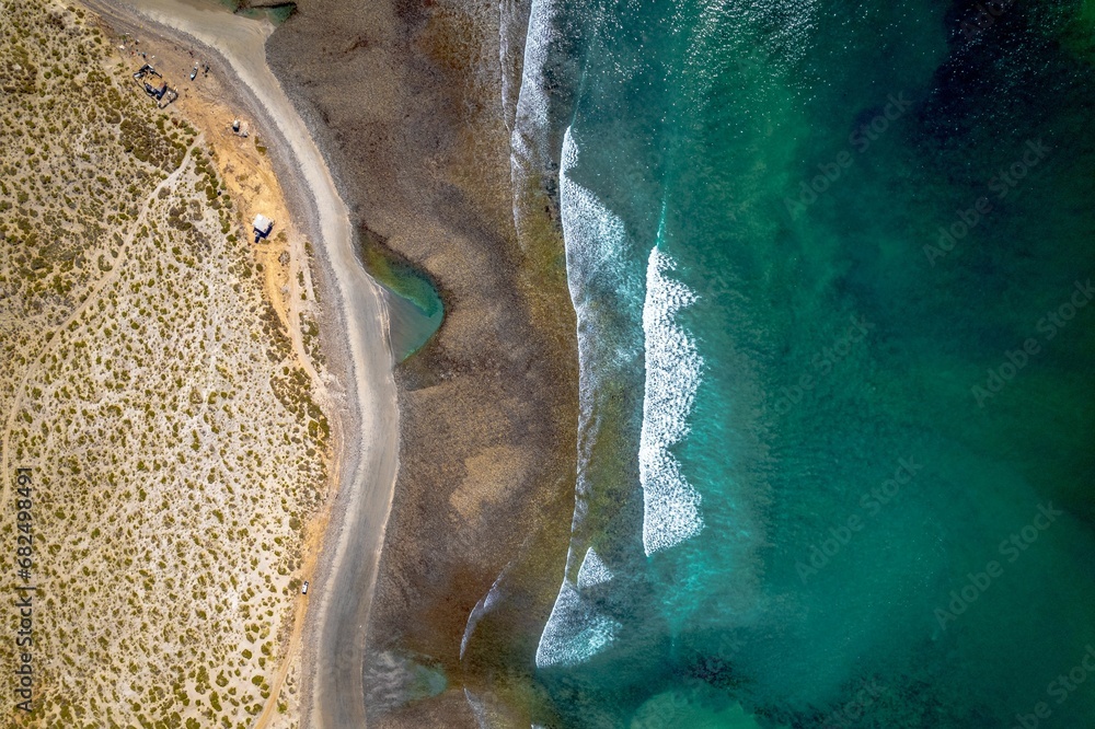 Aerial view of a pristine beach situated in the middle of the vast ocean, Baja beach