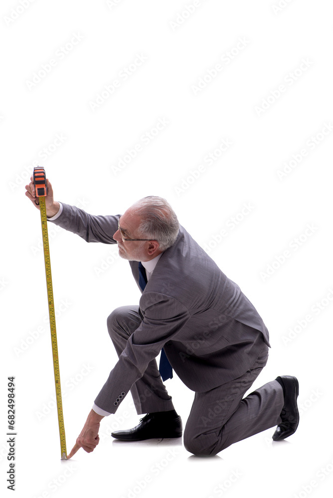 Old businessman holding tape measure isolated on white Old businessman holding tape measure isolated on white