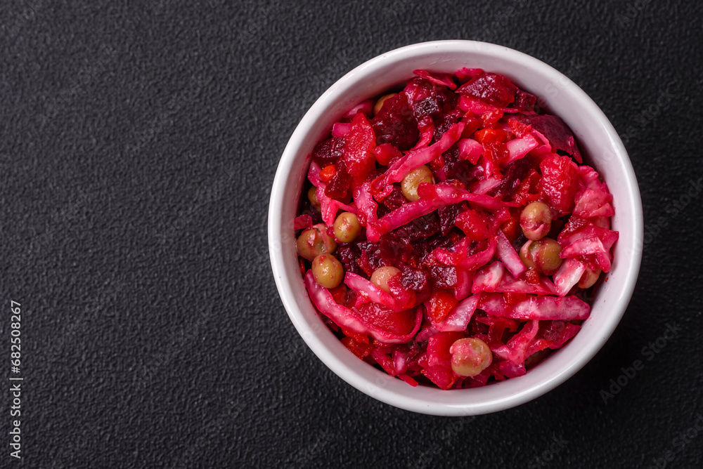 Delicious juicy vinigret salad of boiled vegetables potatoes, beets, pot, cabbage and carrots Delicious juicy vinigret salad of boiled vegetables potatoes, beets, pot, cabbage and carrots