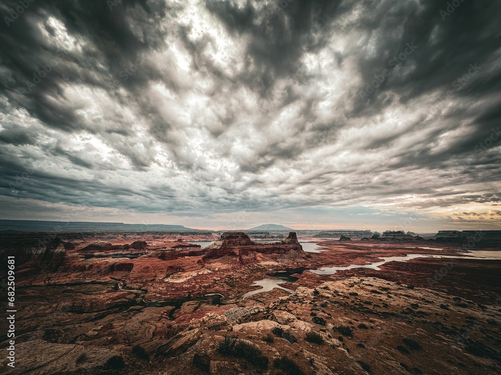 Dramatic view of a large rocky mountain landscape with the Lake Powell