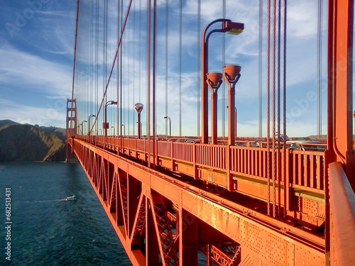 a close up of the golden gate bridge with blue sky
