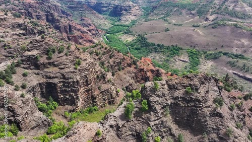 Aerial Kauai Hawaii up Waimea Canyon valley 1. Garden Isle of the Pacific Ocean. Volcanic mountain geology. Grand Canyon, jungle, rain forest, deep valley, mountains. Economy tourism. photo