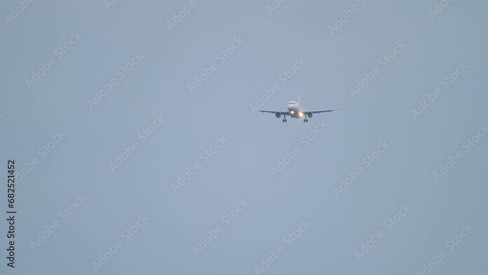 Commwercial plane approaching landing, long shot. Airliner flying. Passenger flight arriving Commwercial plane approaching landing, long shot. Airliner flying. Passenger flight arriving