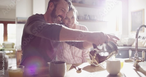 Couple, man or woman and coffee in kitchen for morning breakfast, caffeine or wellness in home with sunlight. People, espresso or talking on weekend for peace, relax and bonding with love or care photo