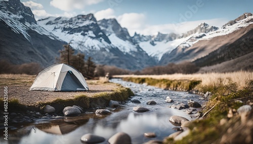 Amazing mountain landscape: tent on the shore. small river meanders through the valley. sunny day perfect for hiking and exploring nature. travel and nature concept. blurred foreground. ai generated. 