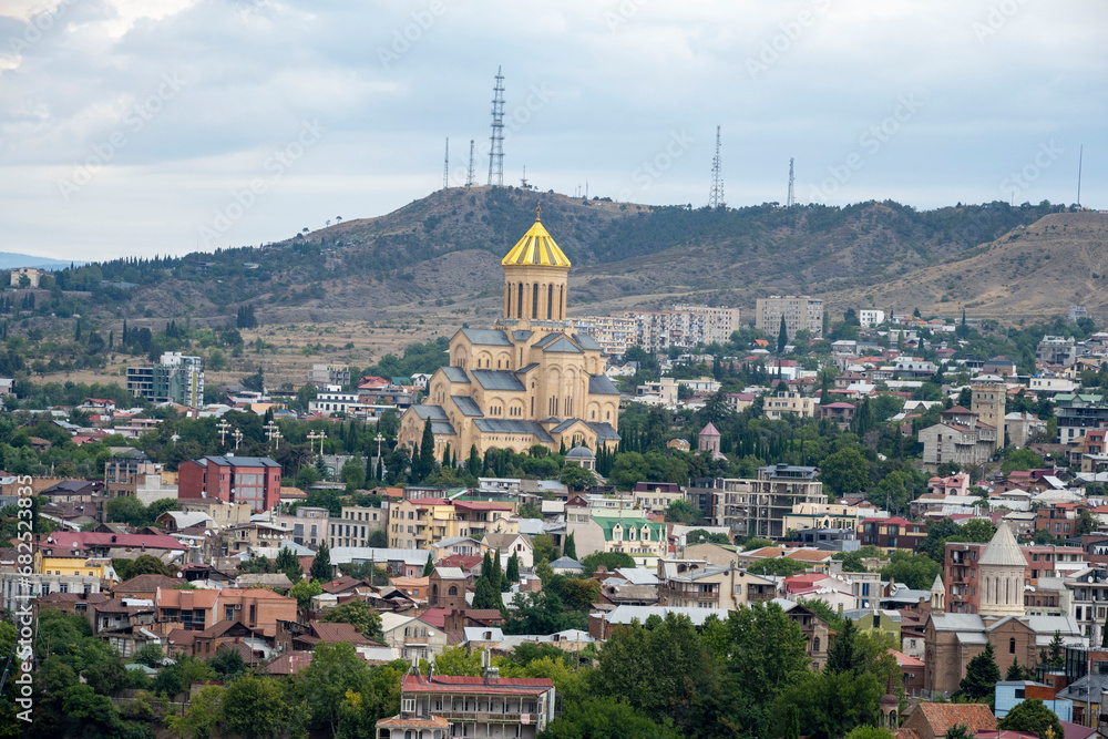 The Kura river, The Bridge of Peace, The Holy Trinity Cathedral of Tbilisi, churches and the magnificent view of Tbilisi city from the cable car.