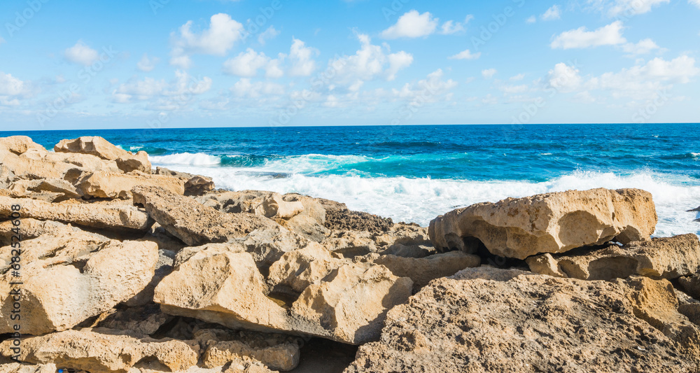 Yellow rocks by the shore in Sardinia