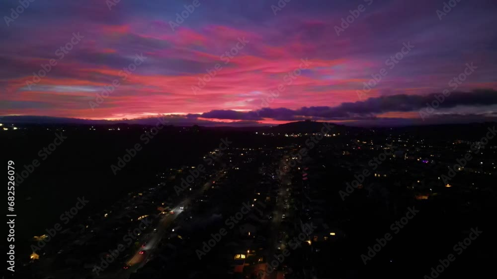 Paignton, Torbay, South Devon, England: DRONE VIEWS: A deep red sunset illuminates the skyline. Paignton is a popular UK holiday resort and destination with many tourist attractions (Clip 3). Paignton, Torbay, South Devon, England: DRONE VIEWS: A deep red sunset illuminates the skyline. Paignton is a popular UK holiday resort and destination with many tourist attractions (Clip 3).