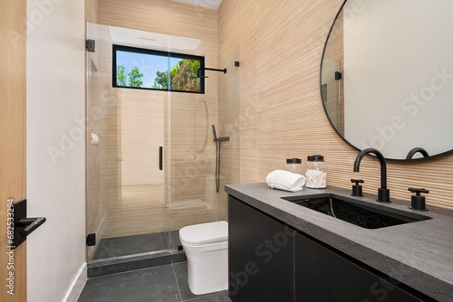 Obraz na plátně the bathroom is clean and ready to use, with a shower