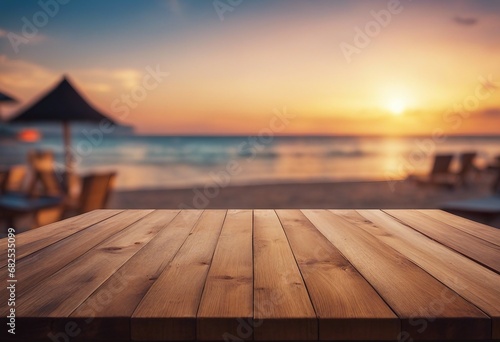 Wooden table top on blur beach cafes background at sunset - can be used for display or montage your product