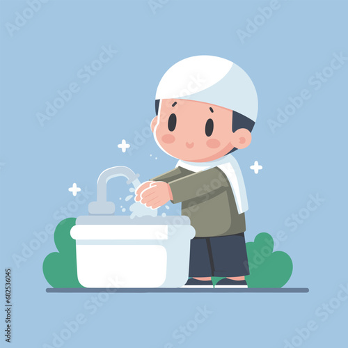 Muslim child washes hands in tap water for ablution before prayer