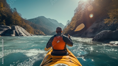 Man explores a challenging mountain river while kayaking © muji