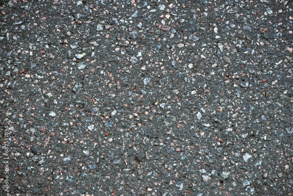 Surface grunge rough of asphalt. Tarmac dark grey grainy road. Texture Background Top view close up Surface grunge rough of asphalt. Tarmac dark grey grainy road. Texture Background Top view close up