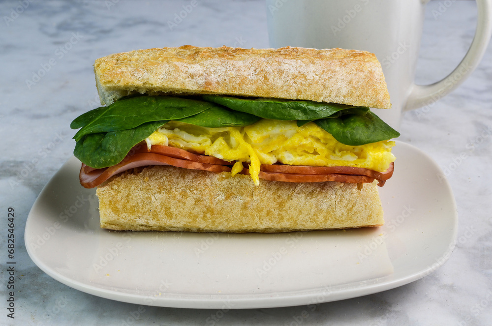 scramble eggs with canadian bacon on ciabatta bread scramble eggs with canadian bacon on ciabatta bread