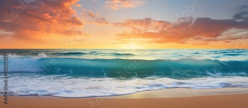 As the sun sets over the ocean, painting the sky with beautiful hues of blue and orange, the waves gently crash against the sandy beach, creating a harmonious melody that echoes through the tropical