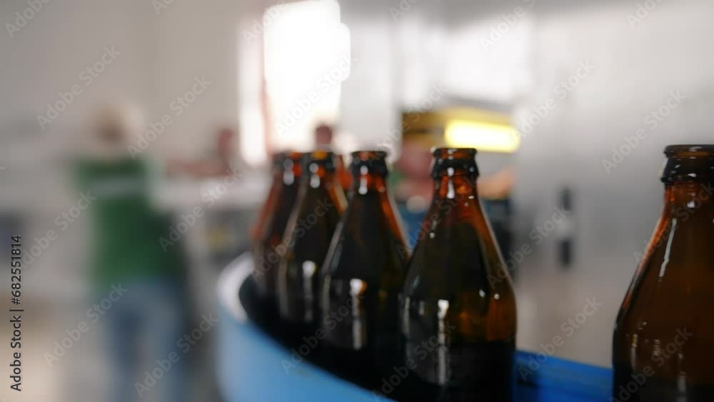 Craft beer production. Conveyor with empty bottles. Dark glass bottles for light beer. Automatic line Craft beer production. Conveyor with empty bottles. Dark glass bottles for light beer. Automatic line