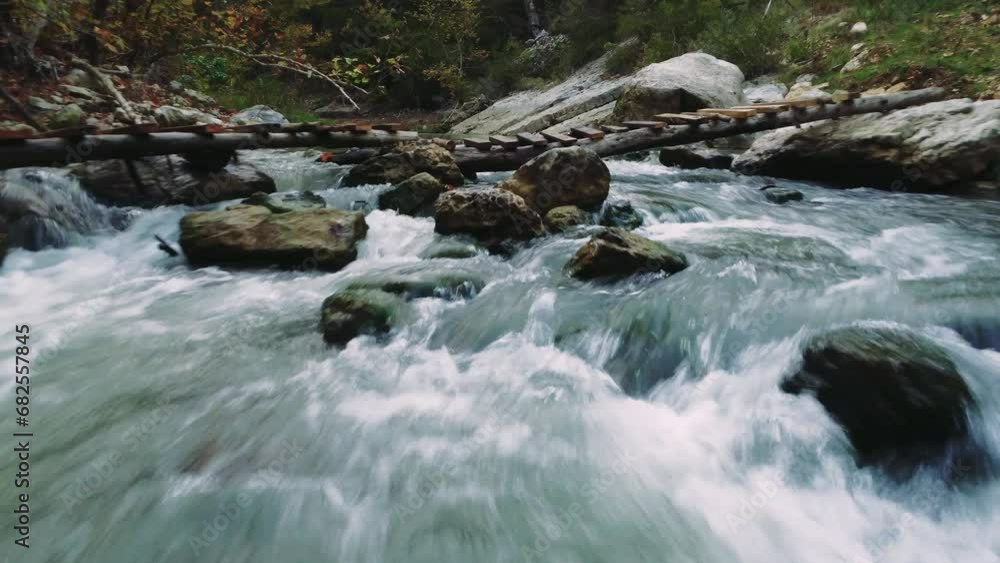 Drone view in Kapikaya captures a trekking trail with a wooden bridge. Trekking over a mountain river inspires wanderlust. Wanderlust thrives in trekking across Kapikaya's serene landscape Drone view in Kapikaya captures a trekking trail with a wooden bridge. Trekking over a mountain river inspires wanderlust. Wanderlust thrives in trekking across Kapikaya's serene landscape