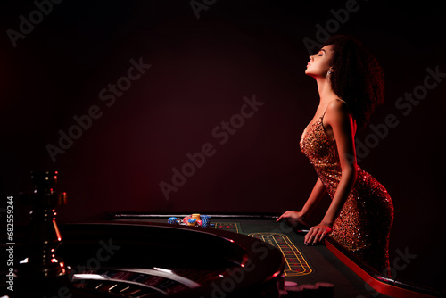 Photo of chic stunning lady dealer in night club casino prepare for private game for million jackpot with neon filter