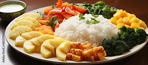 In Country, an Asian country known for its delicious and diverse cuisine, a white plate is adorned with a healthy meal. The flat shape of the Countryn snack is filled with a variety of vegetables photo