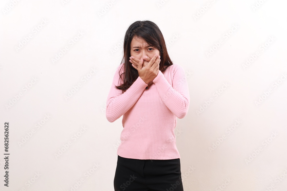 Young asian girl covering her mouth. No talking concept. Isolated on white background Young asian girl covering her mouth. No talking concept. Isolated on white background