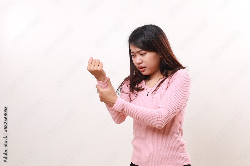 Young asian woman suffering pain on hands and wrist, arthritis inflammation concept. Isolated on white Young asian woman suffering pain on hands and wrist, arthritis inflammation concept. Isolated on white
