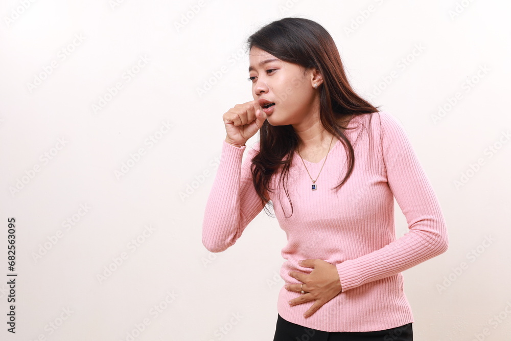 Young asian woman suffering with cough and feeling bad. Isolated on white with copyspace Young asian woman suffering with cough and feeling bad. Isolated on white with copyspace
