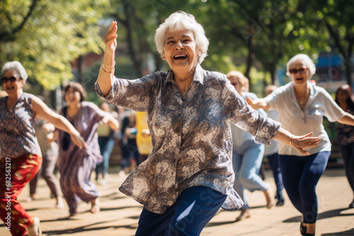 Elderly women dancing in park. Happy square dance senior people. Outdoor physical activity for grandparents photo