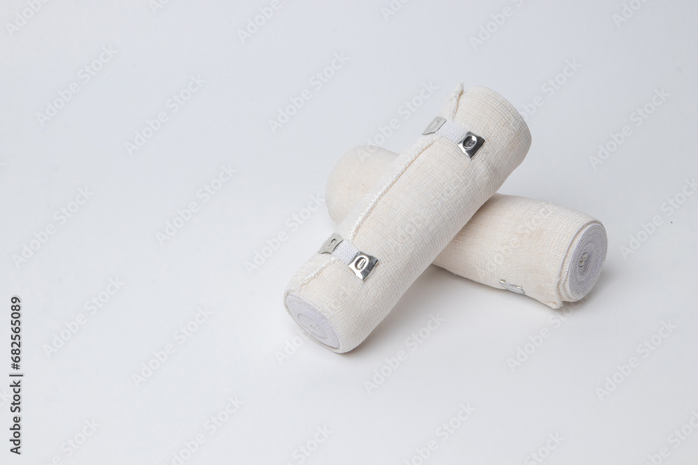 Naklejka premium Medical bandage rolls, bandage, elastic , scotch tape, first aid supplies, a white background.