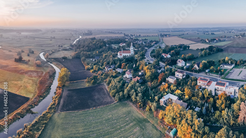 Aerial autumn view at church in Chelmno on the Ner River, a village in Poland photo