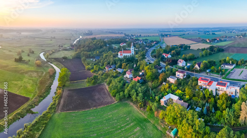 Aerial autumn view at church in Chelmno on the Ner River, a village in Poland photo