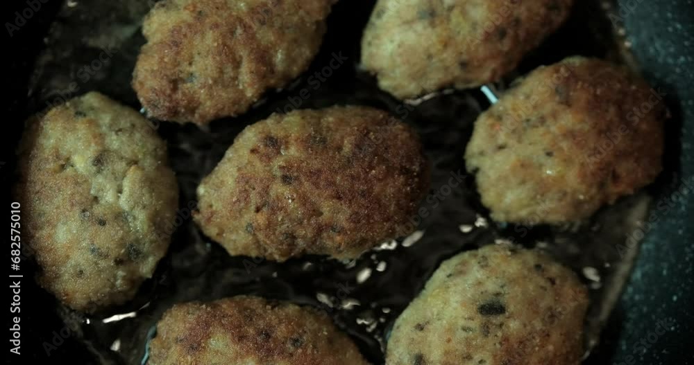 minced cutlet fried in a pan minced cutlet fried in a pan