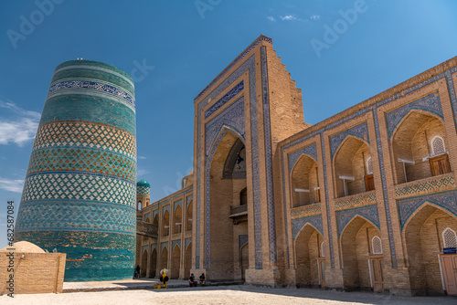Kalta minaret left, muhammad amin khan madrasah right, Khiva, Uzbekistan photo