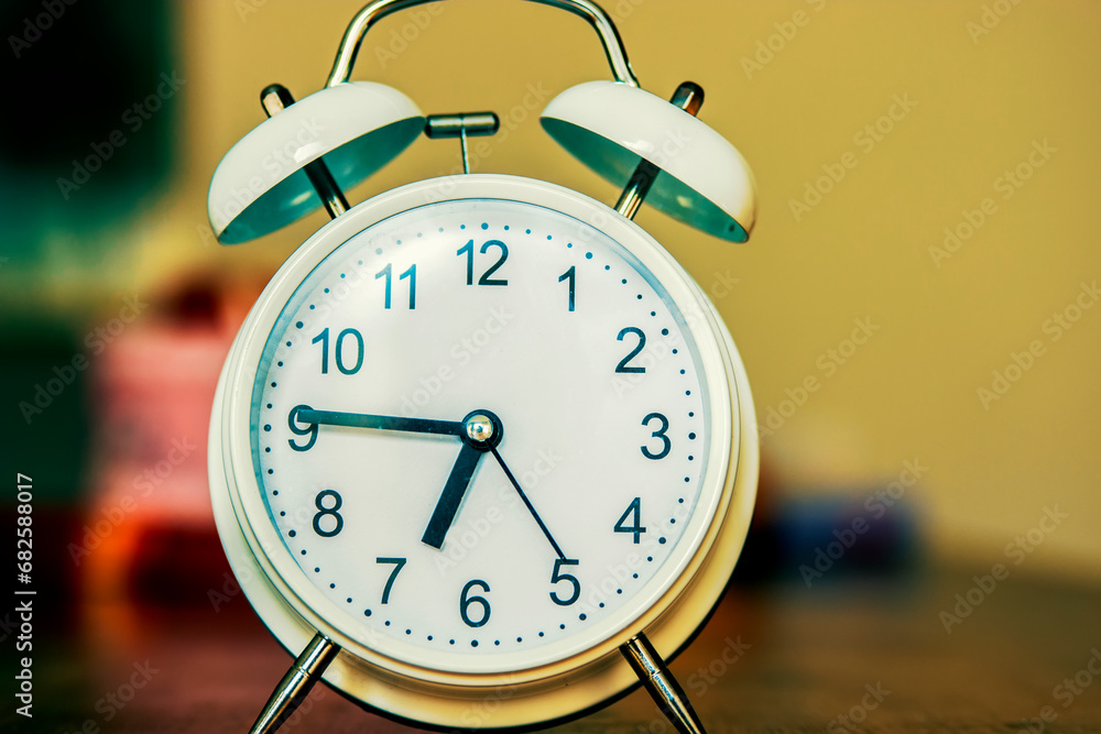 Retro alarm clock on table. Retro alarm clock on table.