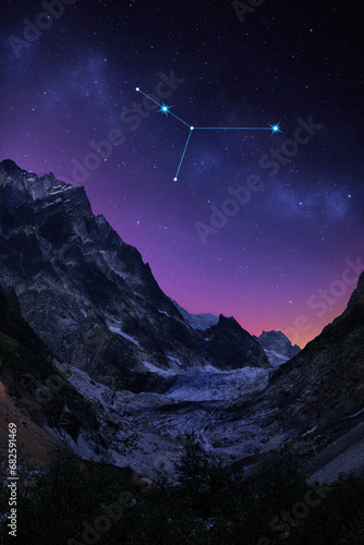 Cancer constellation in starry sky over mountains at night