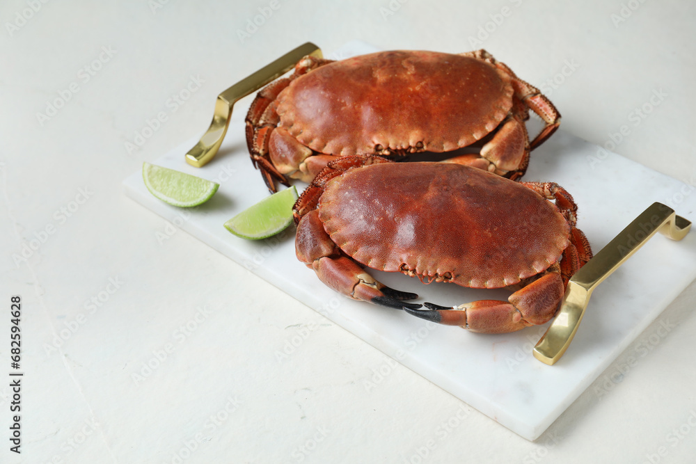 Delicious boiled crabs and lime on white table. Space for text Delicious boiled crabs and lime on white table. Space for text