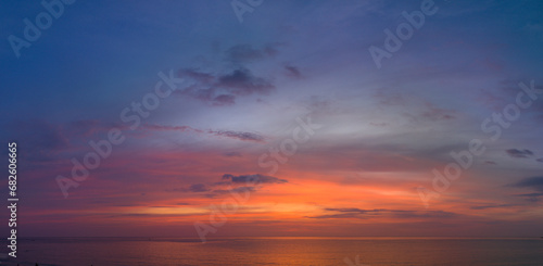 Aerial view amazing colorful sky in sunset above the ocean..beautiful landscape with sweet purple sky in sunset a panoramic view. .Dramatic Sky at sweet Sunset and purple hour © Narong Niemhom