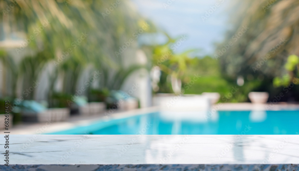 Empty white marble stone table top and blurred swimming pool in tropical resort in summer banner background - can used for display or montage your products.
