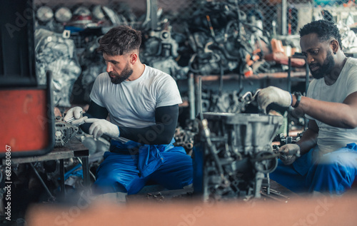 Car technician check engines, choose quality gear for precise repairs to ensure optimal performance