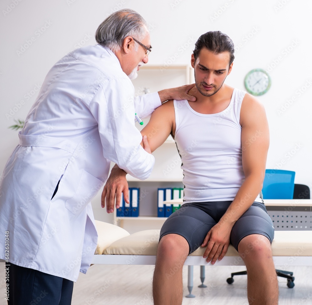 Fototapeta premium Young male patient visiting experienced doctor