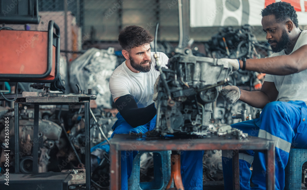 Car technician check engines, choose quality gear for precise repairs to ensure optimal performance Car technician check engines, choose quality gear for precise repairs to ensure optimal performance