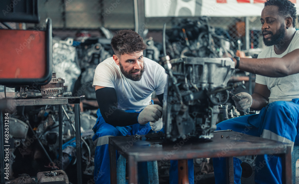 Car technician check engines, choose quality gear for precise repairs to ensure optimal performance Car technician check engines, choose quality gear for precise repairs to ensure optimal performance