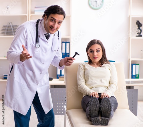 Young male doctor and female beautiful patient