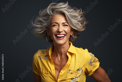 Beautiful middle aged woman wearing bright color shirt with smile on her face, mature women lifestyle and fashion.
