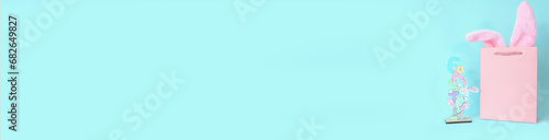 ready easter banner, pink gift bag with bunny ears and figurine easter. Postcard, shopping, shopping, gift, surprise. High quality photo