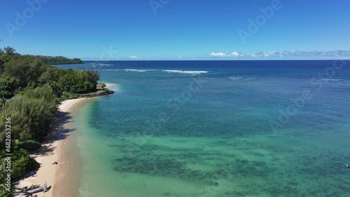 Aerial Kauai Hawaii ‭Anini Beach Pacific Ocean. Surfing and swimming tourist Hawaiian seascape recreation. Volcanic lava rocky coast geology. Beautiful blue turquoise Pacific ocean water. photo